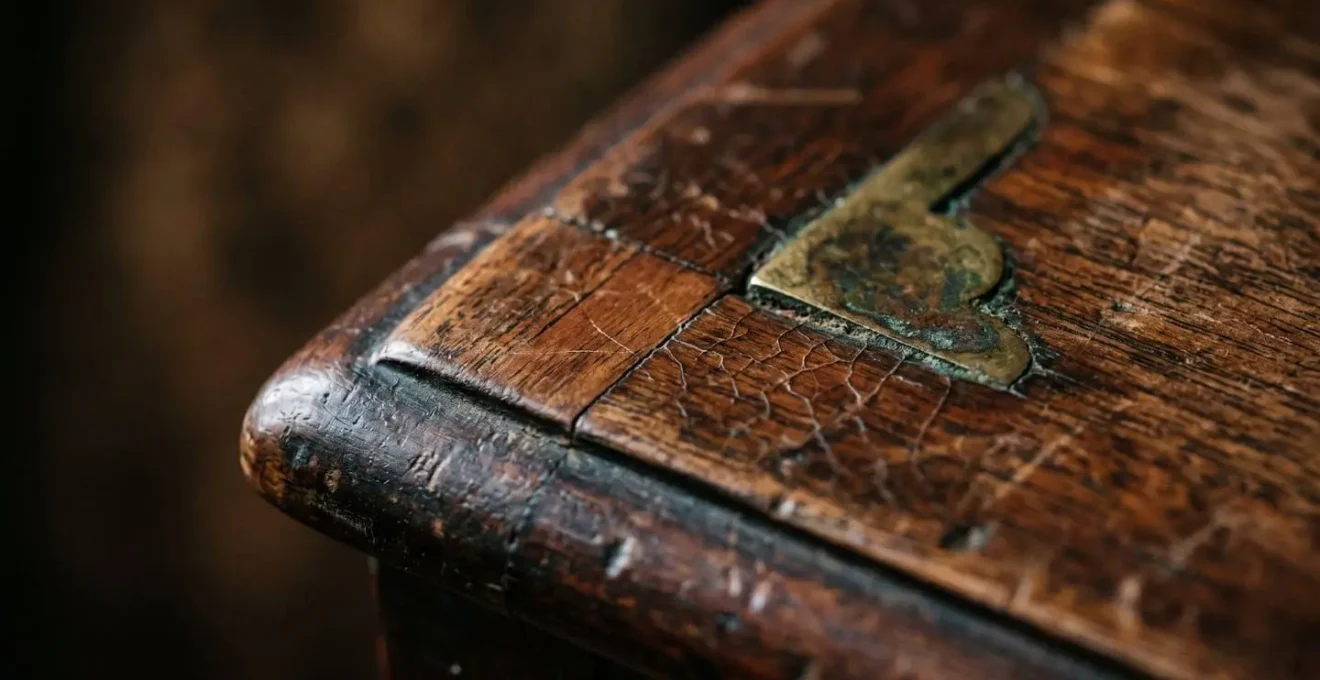 Extreme close-up macro photograph of authentic 19th-century furniture patina showing natural aging and historical wear patterns