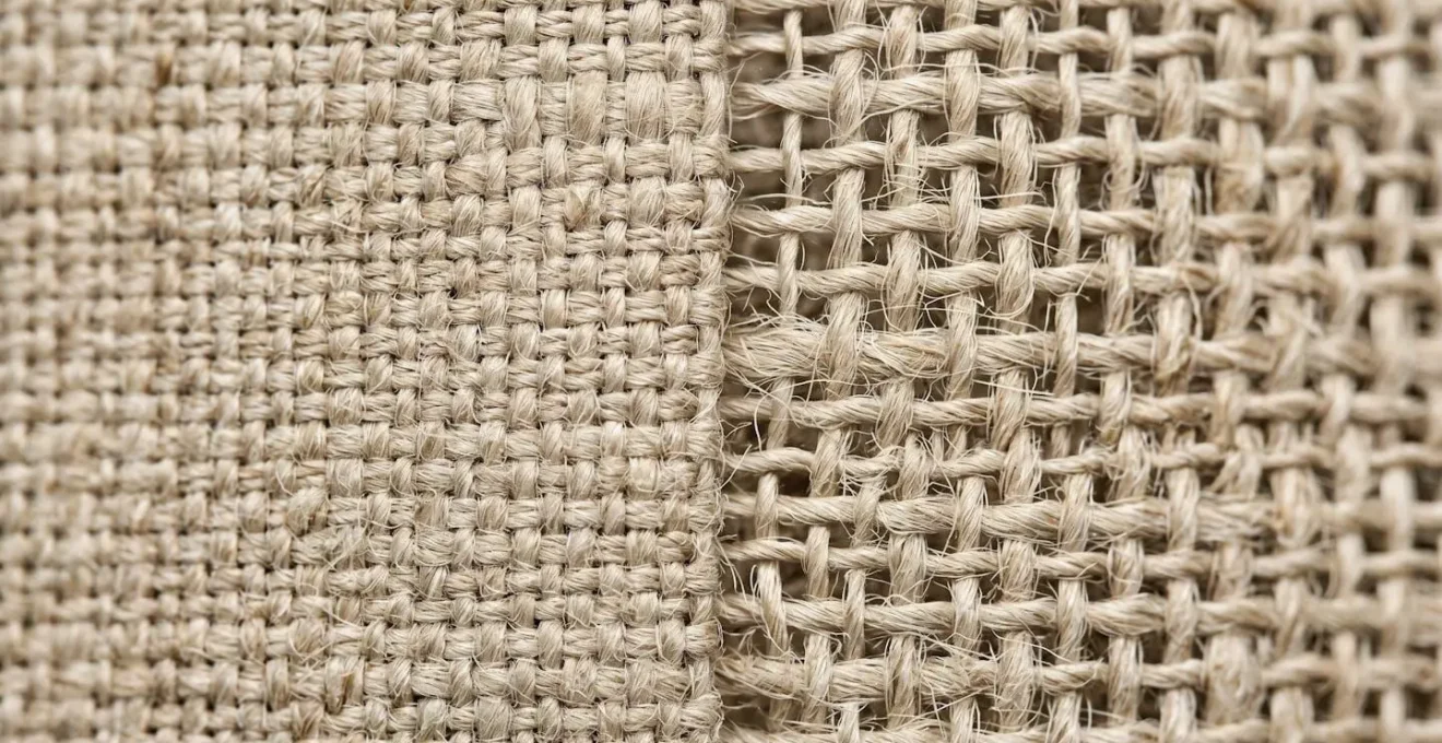 Extreme close-up macro photography revealing the intricate weave structure and fiber texture of natural linen fabric