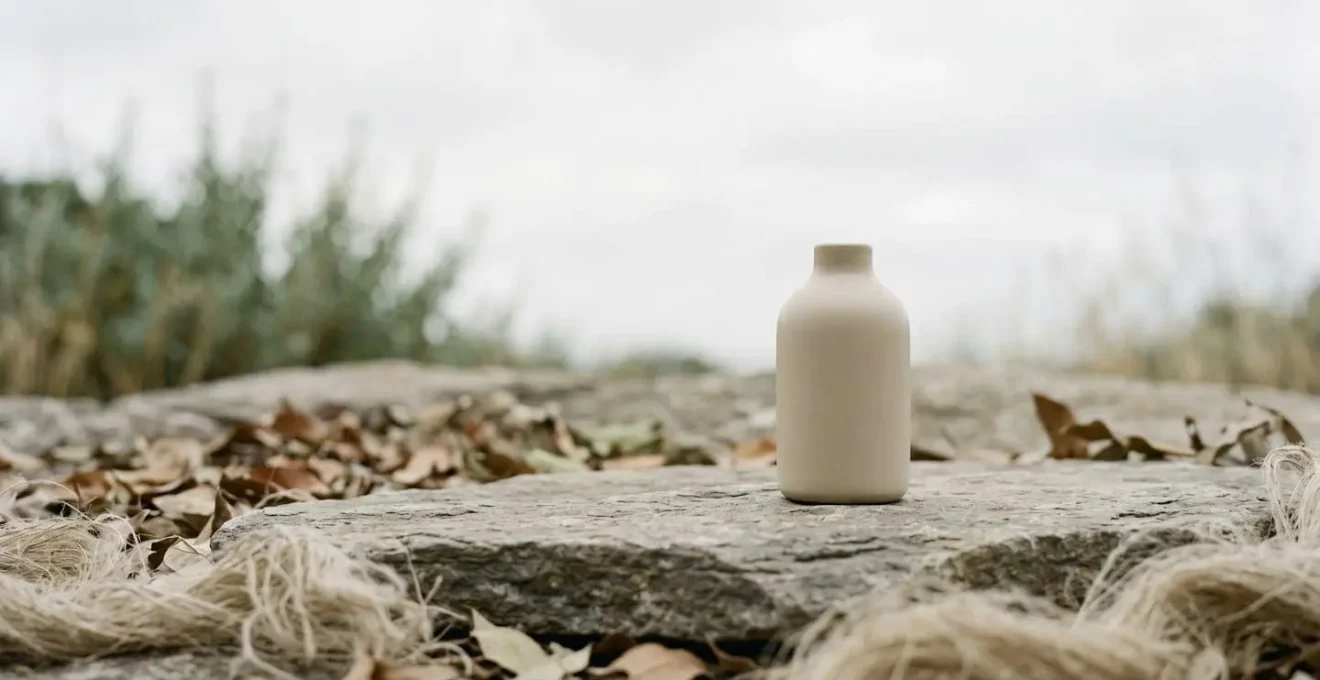 Wide environmental shot of generic eco-friendly product on natural surface with intentional negative space, suggesting sustainability claims versus reality